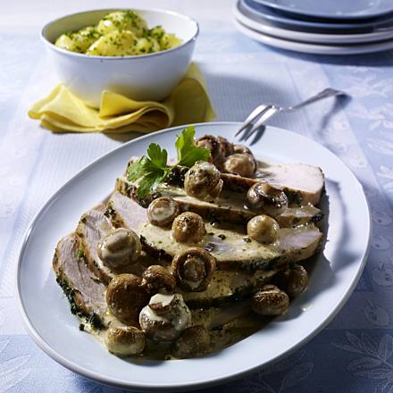 Roast turkey with herb topping and mushroom sauce