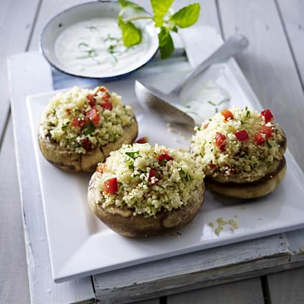 Giant mushrooms filled with couscous, paprika, parsley and mint yogurt